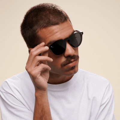 Komodo - round sustainable dark brown bamboo sunglasses, grey polarized lenses - male model
