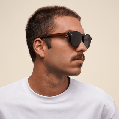Komodo - round sustainable dark brown bamboo sunglasses, grey polarized lenses - male model