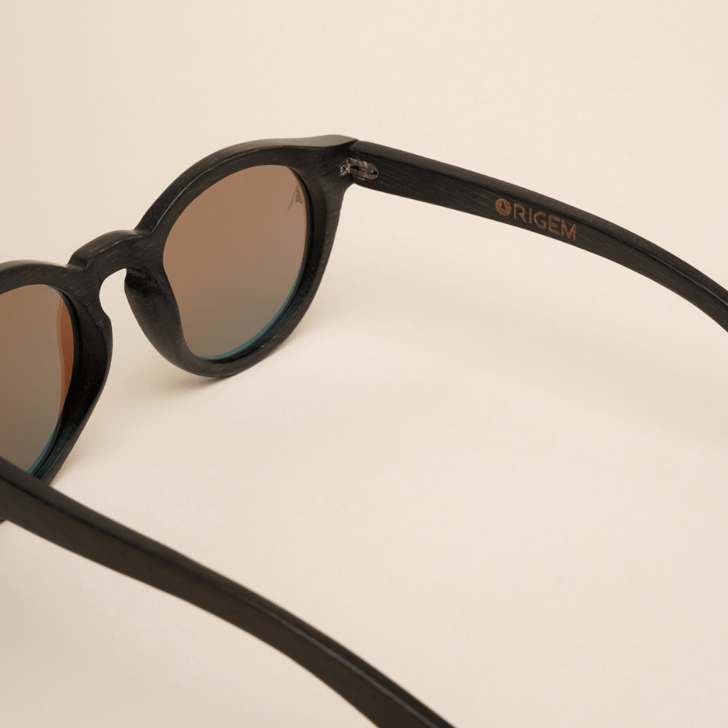 Galapagos Blue - round sustainable black bamboo sunglasses, mirrored blue polarized lenses - close up